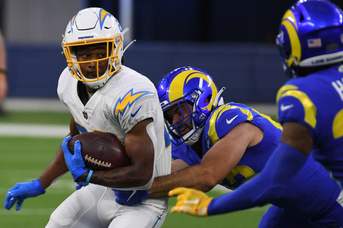 Aug 14, 2021; Inglewood, California, USA; Los Angeles Rams linebacker Justin Lawler (53, center) and defensive back Brontae Harris (35, right) defend against Los Angeles Chargers running back Justin Jackson (22) in the first quarter at SoFi Stadium. Mandatory Credit: Richard Mackson-USA TODAY Sports